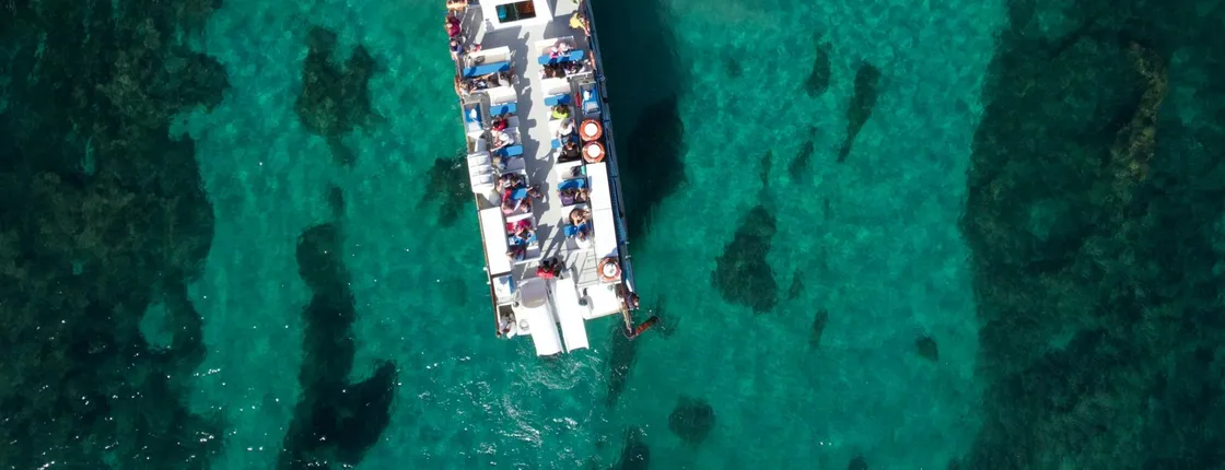 Boat cruise from Cala’n Bosch with snorkelling and onboard bar