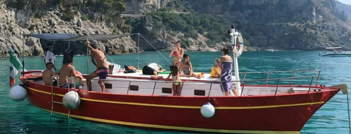 Gozzo boat tour in Naples with swimming stop and local tasting