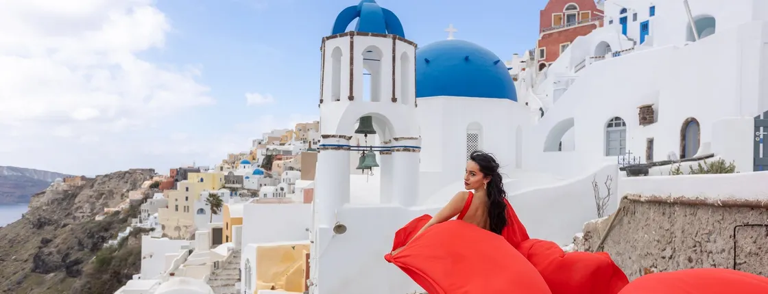 Santorini flying dress photo shoot with a pro photographer