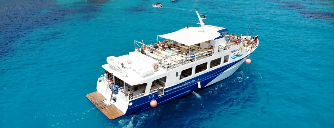 Half-day boat cruise in Menorca with beach stop with transfer
