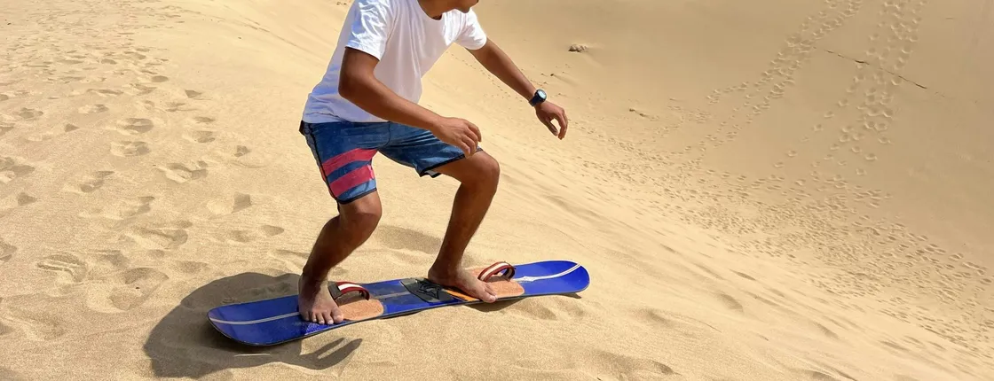 Half-day camel ride and sandboarding experience