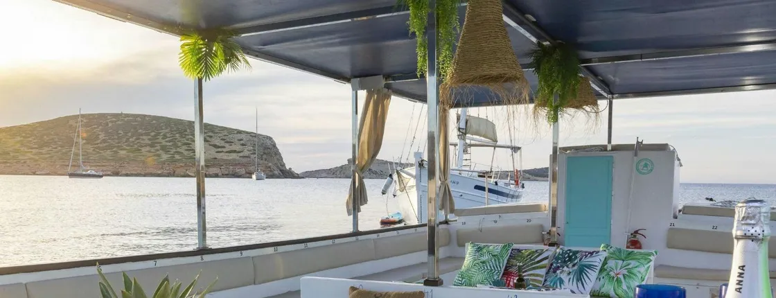 Sunset boat tour with tapas, open bar and water sports in Ibiza