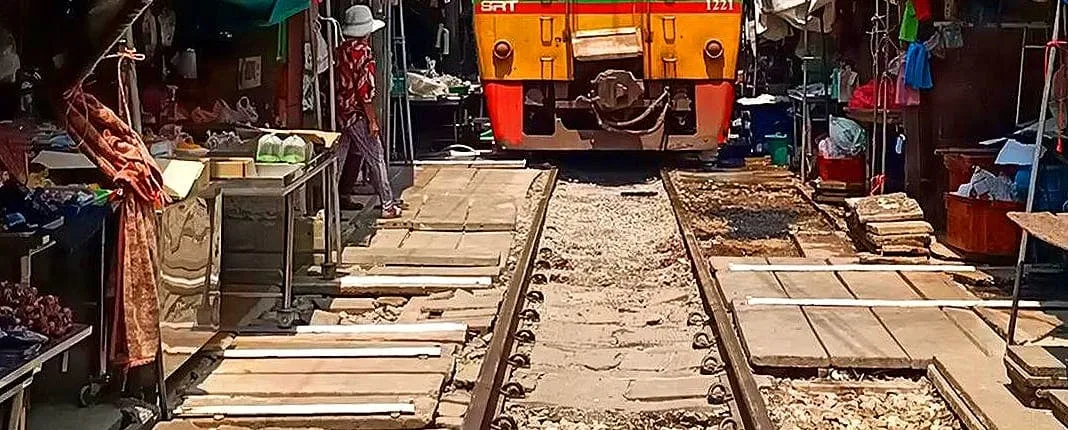 Meet Thai locals and tour Maeklong Railway Market with lunch