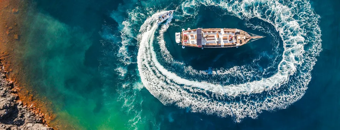 Volcanic islands sunset dinner cruise in Santorini