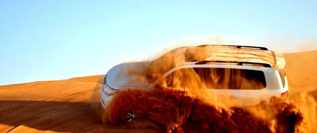 Dubai desert adventure with buggy, dune bashing and camel ride