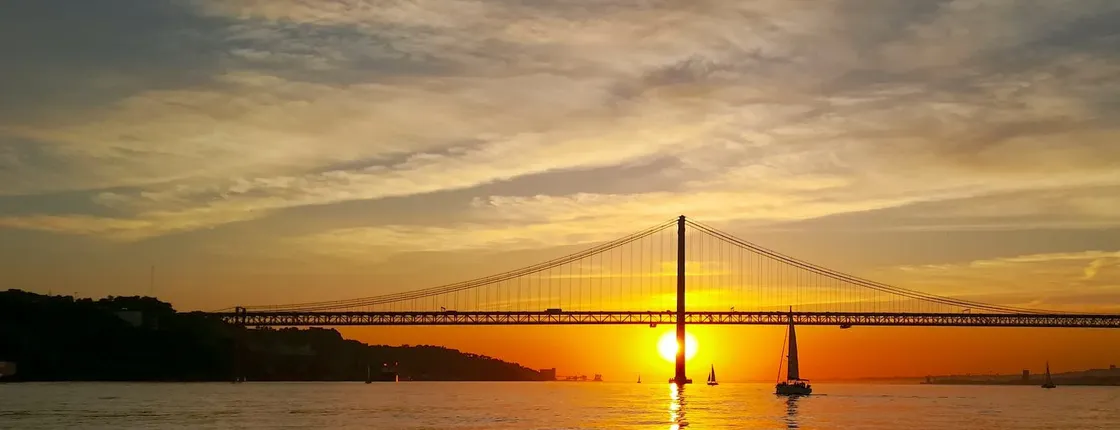 Small-group Lisbon sunset sailing cruise with a welcome drink