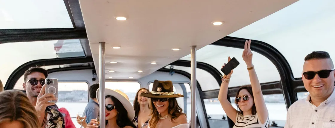 Sunset DJ boat party cruise with open bar and snacks in Lisbon