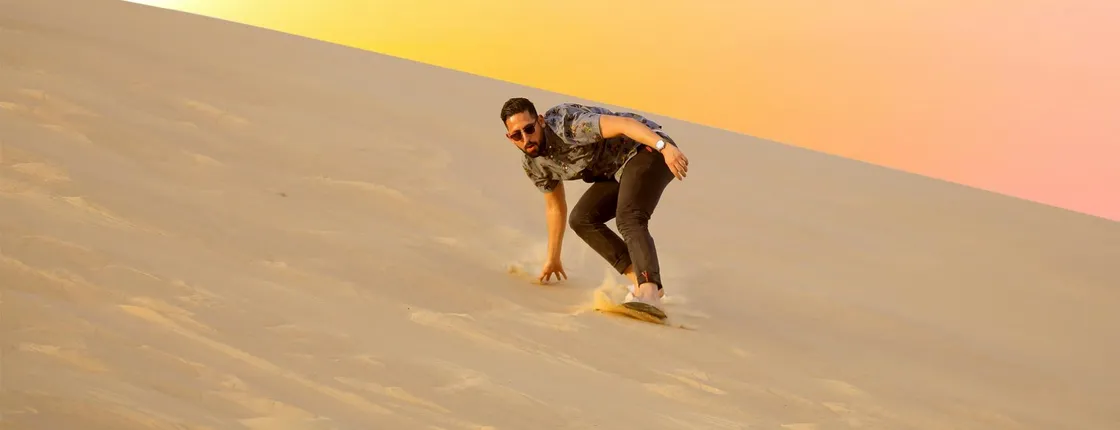 Abu Dhabi sunrise desert adventure with dune bashing and camel ride