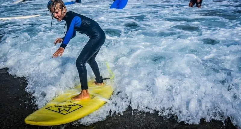 Family surfing session in the south of Fuerteventura