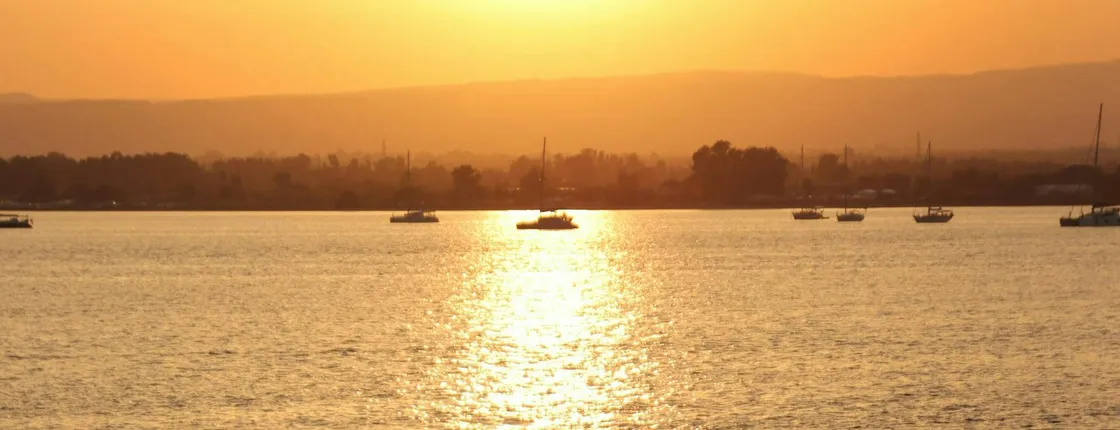 Sunset by boat in Terrasini with aperitif and swimming