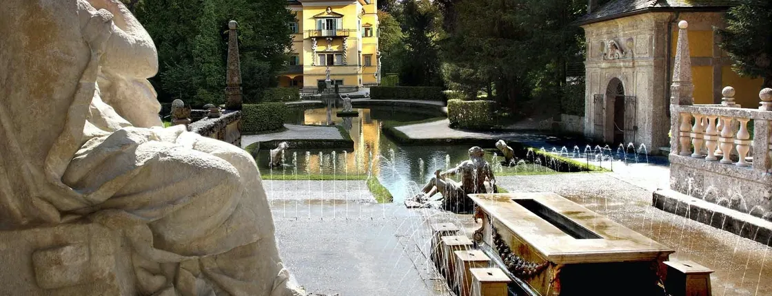 Boat trip to Hellbrunn Palace with trick fountain and London double-decker bus