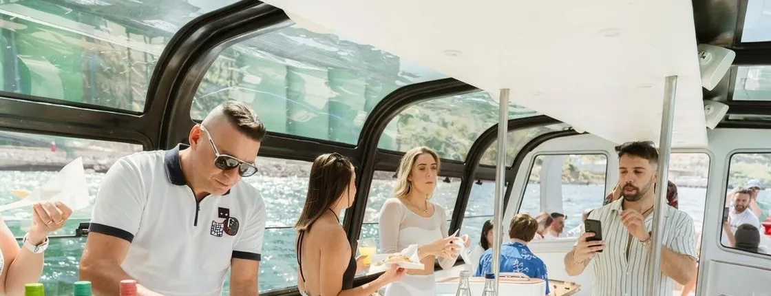 Portuguese wine boat experience with music and snacks in Lisbon