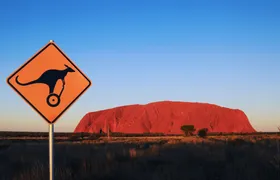 Quarter Uluru self-balancing scooter and sunset
