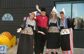 Picture in Volendam costume with cheese and clog tour